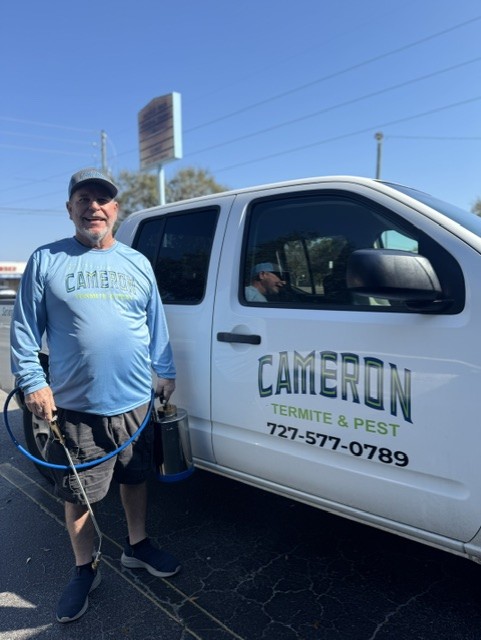 Cameron Termite & Pest Control team member with the service truck